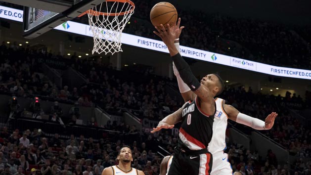 Nov 5, 2017; Portland, OR, USA; Portland Trail Blazers guard Damian Lillard goes in for a basket against Oklahoma City Thunder forward Carmelo Anthony (7) at Moda Center. Photo Credit: Joseph Weiser-USA TODAY Sports