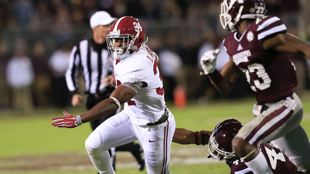 Nov 14, 2015; Starkville, MS, USA; Alabama Crimson Tide running back Damien Harris (34) carries the ball against the Mississippi State Bulldogs at Davis Wade Stadium. The Crimson Tide defeated the Bulldogs 31-6. Mandatory Credit: Marvin Gentry-USA TODAY Sports