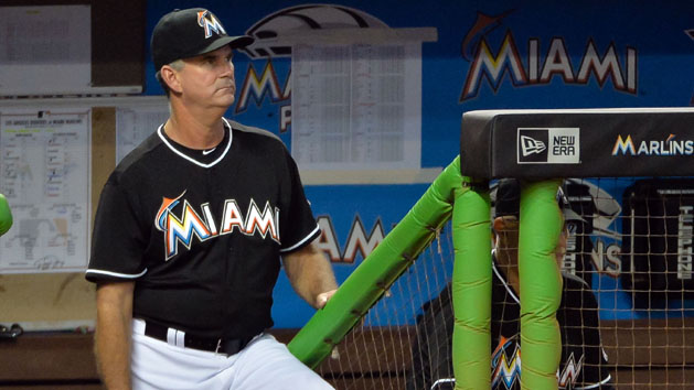 Jun 27, 2015; Miami, FL, USA; Miami Marlins manager Dan Jennings (26) looks on from the dugout during the sixth inning against the Los Angeles Dodgers at Marlins Park. The Marlins won 3-2. Mandatory Credit: Steve Mitchell-USA TODAY Sports
