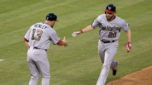 May 30, 2016; Philadelphia, PA, USA; Washington Nationals second baseman Daniel Murphy (20) is congratulated by third base coach Bob Henley (13) after hitting a solo home run against the Philadelphia Phillies during the fourth inning at Citizens Bank Park. Mandatory Credit: Bill Streicher-USA TODAY Sports
