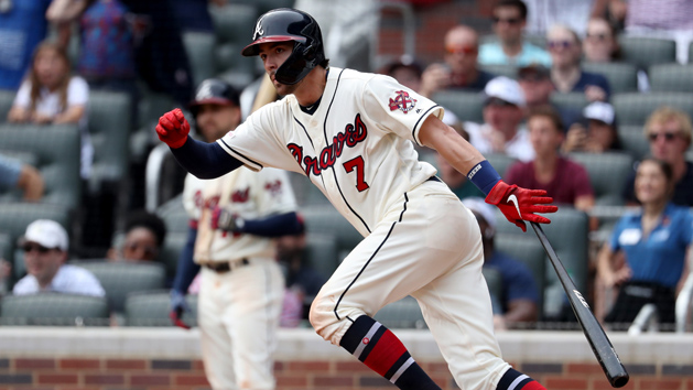 Apr 7, 2019; Atlanta, GA, USA; Atlanta Braves shortstop Dansby Swanson (7) hits a game-winning walk-off single to score first baseman Freddie Freeman (not pictured) in the ninth inning against the Miami Marlins at SunTrust Park. Photo Credit: Jason Getz-USA TODAY Sports