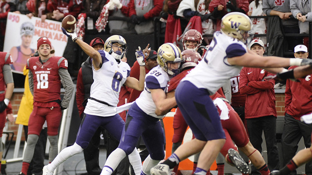 Nov 25, 2016; Pullman, WA, USA; Washington Huskies wide receiver Dante Pettis (8) throws a pass against the Washington State Cougars during the first half at Martin Stadium. Photo Credit: James Snook-USA TODAY Sports