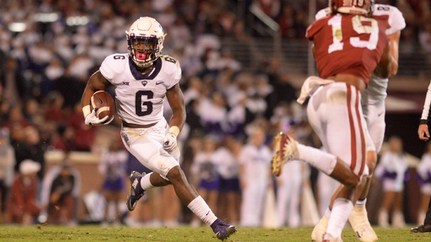 Nov 11, 2017; Norman, OK, USA; TCU Horned Frogs running back Darius Anderson (6) runs through a hold in the Oklahoma Sooners defense during the second quarter at Gaylord Family - Oklahoma Memorial Stadium. Photo Credit: Mark D. Smith-USA TODAY Sports
