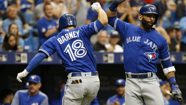 May 7, 2017; St. Petersburg, FL, USA; Toronto Blue Jays third baseman Darwin Barney (18) celebrates with Blue Jays right fielder Jose Bautista (19) after hitting a home run during the eighth inning against the Tampa Bay Rays at Tropicana Field. The Blue Jays won 2-1. Photo Credit: Kim Klement-USA TODAY Sports