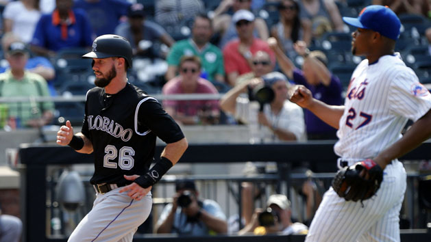 Jul 28, 2016; New York City, NY, USA; Colorado Rockies center fielder David Dahl (26) scores the go ahead run after a wild pitch by New York Mets relief pitcher Jeurys Familia (27) during the ninth inning at Citi Field. The Colorado Rockies defeated the New York Mets 2-1. Photo Credit: Noah K. Murray-USA TODAY Sports