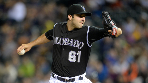 Jul 9, 2015; Denver, CO, USA; Colorado Rockies starting pitcher David Hale (61) delivers a pitch in the second inning against the Atlanta Braves at Coors Field. (Ron Chenoy-USA TODAY Sports)
