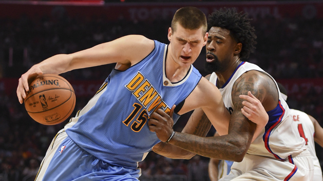 Mar 27, 2016; Los Angeles, CA, USA; Denver Nuggets center Nikola Jokic (15) is defended by Los Angeles Clippers center DeAndre Jordan (6) during an NBA game at Staples Center. Mandatory Credit: Kirby Lee-USA TODAY Sports