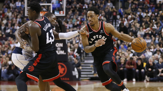 Mar 16, 2018; Toronto, Ontario, CAN; Toronto Raptors guard DeMar DeRozan (10) drives to the net as forward Pascal Siakam (43) blocks a Dallas Mavericks player at the Air Canada Centre. Toronto defeated Dallas in overtime. Photo Credit: John E. Sokolowski-USA TODAY Sports
