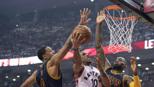May 23, 2016; Toronto, Ontario, CAN; Toronto Raptors guard DeMar DeRozan (10) drives to the basket as Cleveland Cavaliers forward LeBron James (23) and forward Channing Frye (9) try to defend during the first quarter in game four of the Eastern conference finals of the NBA Playoffs at Air Canada Centre. Mandatory Credit: Nick Turchiaro-USA TODAY Sports