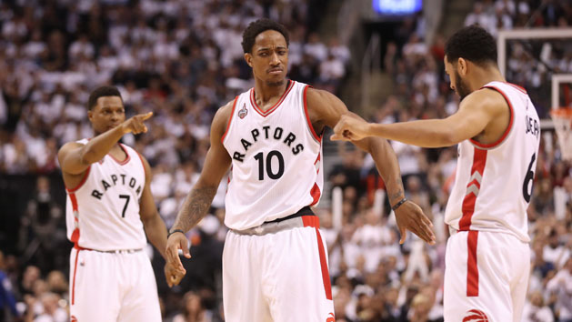 May 11, 2016; Toronto, Ontario, CAN; Toronto Raptors guard DeMar DeRozan (10) celebrates his basket with point guard Cory Joseph (6) and point guard Kyle Lowry (7) against the Miami Heat in game five of the second round of the NBA Playoffs at Air Canada Centre. The Raptors beat the Heat 99-91. Mandatory Credit: Tom Szczerbowski-USA TODAY Sports