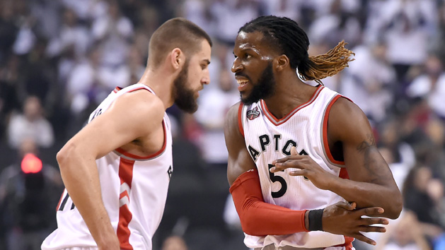 May 5, 2016; Toronto, Ontario, CAN; Toronto Raptors forward DeMarre Carroll (5) slaps hands with center Jonas Valanciunas (17) after scoring a basket against Miami Heat in game two of the second round of the NBA Playoffs at Air Canada Centre. The Raptors won 96-92. Mandatory Credit: Dan Hamilton-USA TODAY Sports