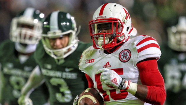 Oct 4, 2014; East Lansing, MI, USA; Nebraska Cornhuskers wide receiver De'Mornay Pierson-El (15) runs back a punt for a touchdown against the Michigan State Spartans during the 2nd half of a game at Spartan Stadium. Mandatory Credit: MSU won 27-22. Mike Carter-USA TODAY Sports