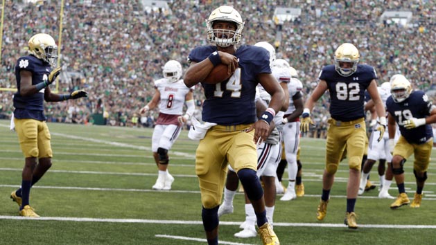 Sep 26, 2015; South Bend, IN, USA; Notre Dame Fighting Irish quarterback DeShone Kizer (14) runs the ball in for a touchdown against the Massachusetts Minutemen at Notre Dame Stadium. Mandatory Credit: Brian Spurlock-USA TODAY Sports