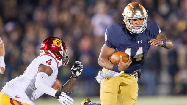 Oct 17, 2015; South Bend, IN, USA; Notre Dame Fighting Irish quarterback DeShone Kizer (14) carries the ball as USC Trojans safety Chris Hawkins (4) defends in the second quarter at Notre Dame Stadium. Notre Dame won 41-31. Mandatory Credit: Matt Cashore-USA TODAY Sports