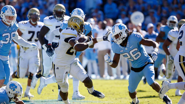 Nov 5, 2016; Chapel Hill, NC, USA; Georgia Tech Yellow Jackets running back Dedrick Mills (26) runs with the ball against North Carolina Tar Heels defensive back Dominquie Green (26) at Kenan Memorial Stadium. The North Carolina Tar Heels defeated the Georgia Tech Yellow Jackets 48-20. Photo Credit: James Guillory-USA TODAY Sports