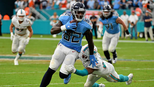 Sep 9, 2018; Miami Gardens, FL, USA; Tennessee Titans tight end Delanie Walker (82) avoids the tackle of Miami Dolphins cornerback Bobby McCain (28) during the second half at Hard Rock Stadium. Photo Credit: Jasen Vinlove-USA TODAY Sports