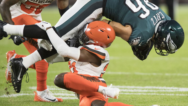 Aug 23, 2018; Cleveland, OH, USA; Cleveland Browns cornerback Denzel Ward (21) tackles Philadelphia Eagles tight end Zach Ertz (86) during the first quarter at FirstEnergy Stadium. Ward was injured on the play. Photo Credit: Ken Blaze-USA TODAY Sports