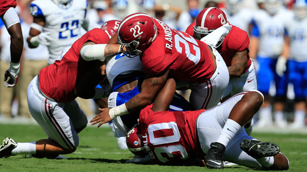 Sep 12, 2015; Tuscaloosa, AL, USA; Alabama Crimson Tide linebacker Denzel Devall (30) and linebacker Ryan Anderson (22) wrap up Middle Tennessee Blue Raiders running back Shane Tucker (1) during the first quarter at Bryant-Denny Stadium. Mandatory Credit: Marvin Gentry-USA TODAY Sports