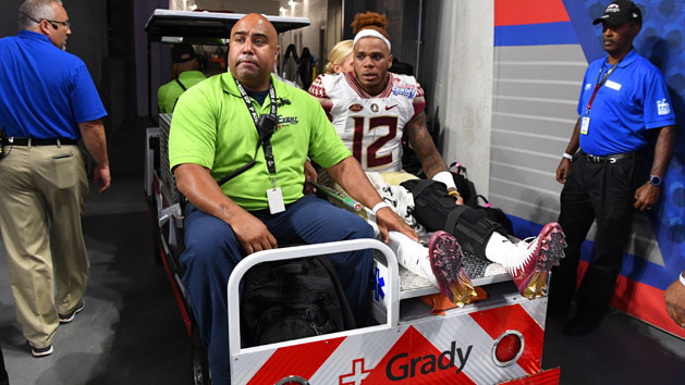 Sep 2, 2017; Atlanta, GA, USA; Florida State Seminoles quarterback Deondre Francois (12) carted off the field after suffering an injury against the Alabama Crimson Tide in the fourth quarter at Mercedes-Benz Stadium. Alabama won 24-7. Mandatory Credit: John David Mercer-USA TODAY Sports