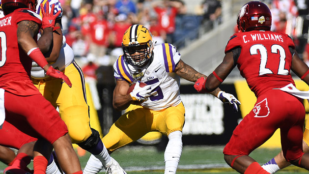 Dec 31, 2016; Orlando, FL, USA; LSU Tigers running back Derrius Guice (5) runs the ball against the Louisville Cardinals during the first half of the Buffalo Wild Wings Citrus Bowl at Camping World Stadium. Photo Credit: Jonathan Dyer-USA TODAY Sports