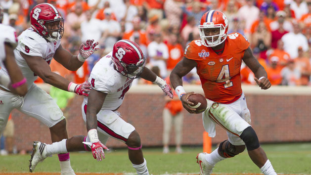 Oct 15, 2016; Clemson, SC, USA; Clemson Tigers quarterback Deshaun Watson (4) carries the ball while being defended by North Carolina State Wolfpack linebacker Jerod Fernandez (4) during the second half at Clemson Memorial Stadium. Tigers won 24-17. Photo Credit: Joshua S. Kelly-USA TODAY Sports