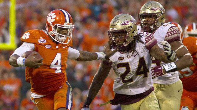 Nov 7, 2015; Clemson, SC, USA; Clemson Tigers quarterback Deshaun Watson (4) carries the ball while being defended by Florida State Seminoles linebacker Terrance Smith (24) during the first half at Clemson Memorial Stadium. Mandatory Credit: Joshua S. Kelly-USA TODAY Sports