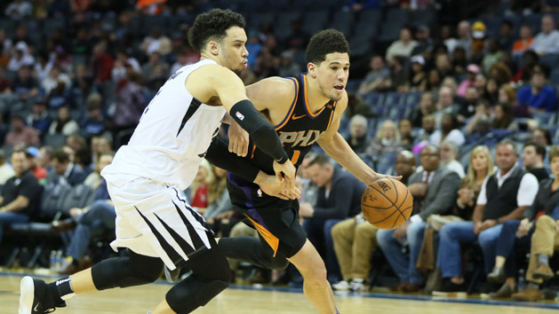 Feb 28, 2018; Memphis, TN, USA; Phoenix Suns guard Devin Booker (1) drives against Memphis Grizzlies guard Dillon Brooks (24) in the second half at FedExForum. Phoenix won 110-102. Photo Credit: Nelson Chenault-USA TODAY Sports