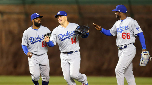Apr 12, 2017; Chicago, IL, USA; Los Angeles Dodgers left fielder Andrew Toles (left) and center fielder Enrique Hernandez (center) and right fielder Yasiel Puig (right) celebrate the final out of the ninth inning against the Chicago Cubs at Wrigley Field. Los Angeles won 2-0. Photo Credit: Dennis Wierzbicki-USA TODAY Sports