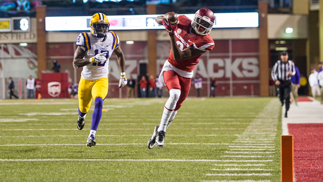 Nov 12, 2016; Fayetteville, AR, USA; Arkansas Razorbacks wide receiver Dominique Reed (3) makes the reception and scores a touchdown as LSU Tigers cornerback Tre'Davious White (18) trails the play during the second quarter of the game at Donald W. Reynolds Razorback Stadium. Mandatory Credit: Brett Rojo-USA TODAY Sports