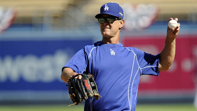 October 8, 2015; Los Angeles, CA, USA; Los Angeles Dodgers manager Don Mattingly (8) throws during workouts before game one of the NLDS at Dodger Stadium. Mandatory Credit: Gary A. Vasquez-USA TODAY Sports