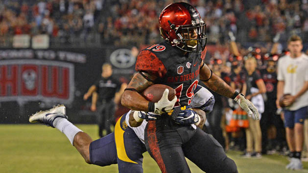 Sep 10, 2016; San Diego, CA, USA; San Diego State Aztecs running back Donnel Pumphrey (19) scores a touchdown as California Golden Bears cornerback Darius Allensworth (2) defends during the fourth quarterat Qualcomm Stadium. Photo Credit: Jake Roth-USA TODAY Sports