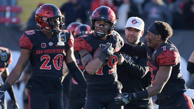 Dec 17, 2016; Las Vegas, NV, USA; San Diego State Aztecs running back Donnel Pumphrey (19) celebrates with running back Rashaad Penny (20) and safety Kameron Kelly (7) a 15-yard run in the fourth quarter to break the FBS career rushing record during the 25th Las Vegas Bowl against the Houston Cougars at Sam Boyd Stadium. Pumphrey finished with 115 yards, giving him 6,405 for his career. San Diego State defeated Houston 34-10. Photo Credit: Kirby Lee-USA TODAY Sports