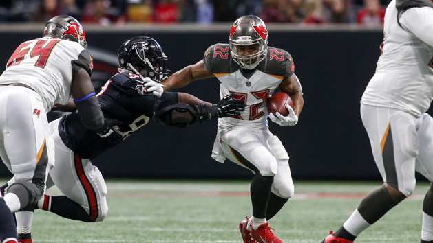 Nov 26, 2017; Atlanta, GA, USA; Tampa Bay Buccaneers running back Doug Martin (22) breaks the tackle of Atlanta Falcons defensive tackle Grady Jarrett (97) in the first quarter at Mercedes-Benz Stadium. Photo Credit: Brett Davis-USA TODAY Sports