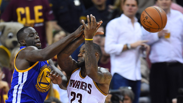 Jun 10, 2016; Cleveland, OH, USA; Golden State Warriors forward Draymond Green (23) knocks the ball from Cleveland Cavaliers forward LeBron James (23) in the second half in game four of the NBA Finals at Quicken Loans Arena. Photo Credit: Bob Donnan-USA TODAY Sports