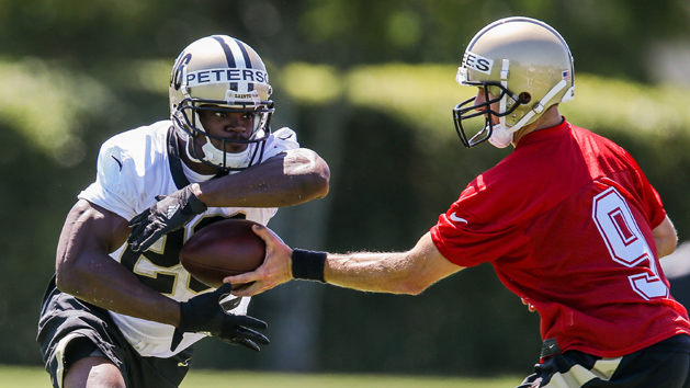 May 25, 2017; New Orleans, LA, USA; New Orleans Saints quarterback Drew Brees (9) hands the ball off to running back Adrian Peterson (28) during organized team activities at the New Orleans Saints training facility. Photo Credit: Stephen Lew-USA TODAY Sports