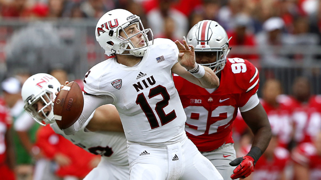 Sep 19, 2015; Columbus, OH, USA; Northern Illinois Huskies quarterback Drew Hare (12) drops to throw during first quarter action versus Ohio State Buckeyes at Ohio Stadium. Northern Illinois Huskies leads 7-3 after the first quarter. Mandatory Credit: Joe Maiorana-USA TODAY Sports