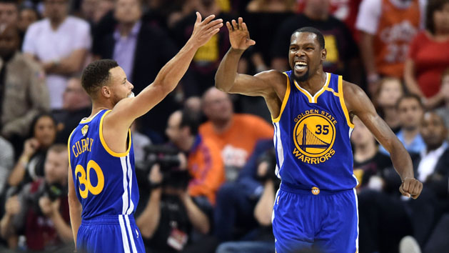 Jun 7, 2017; Cleveland, OH, USA; Golden State Warriors guard Stephen Curry (30) and forward Kevin Durant (35) celebrate during the fourth quarter against the Cleveland Cavaliers in game three of the 2017 NBA Finals at Quicken Loans Arena. Photo Credit: Ken Blaze-USA TODAY Sports