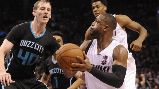 Apr 23, 2016; Charlotte, NC, USA; Miami Heat guard Dwyane Wade (3) looks to shoot as he is defended by Charlotte Hornets forward center Cody Zeller (40) during the second half in game three of the first round of the NBA Playoffs at Time Warner Cable Arena. Hornets win 96-80. Mandatory Credit: Sam Sharpe-USA TODAY Sports