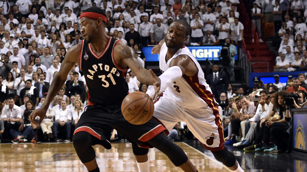 May 9, 2016; Miami, FL, USA; Miami Heat guard Dwyane Wade (3) steals the ball away from Toronto Raptors forward Terrence Ross (31) during the fourth quarter in game four of the second round of the NBA Playoffs at American Airlines Arena. The Heat won in overtime 94-87. Mandatory Credit: Steve Mitchell-USA TODAY Sports