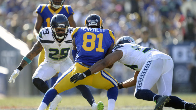 October 8, 2017; Los Angeles, CA, USA; Los Angeles Rams tight end Gerald Everett (81) is brought down by Seattle Seahawks middle linebacker Bobby Wagner (54) and free safety Earl Thomas (29) during the second half at the Los Angeles Memorial Coliseum. Photo Credit: Gary A. Vasquez-USA TODAY Sports