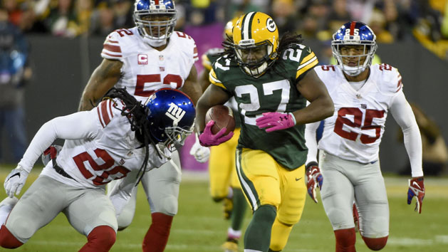 Oct 9, 2016; Green Bay, WI, USA; Green Bay Packers running back Eddie Lacy (27) breaks free for a first down against New York Giants cornerback Janoris Jenkins (20) and cornerback Leon Hall (25) in the second quarter at Lambeau Field. Photo Credit: Benny Sieu-USA TODAY Sports