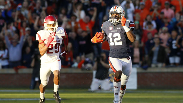 Oct 22, 2016; Auburn, AL, USA; Auburn Tigers receiver Eli Stove (12) gets past Arkansas Razorbacks defensive back Jared Collins (29) and scores a touchdown during the first quarter at Jordan Hare Stadium. Photo Credit: John Reed-USA TODAY Sports