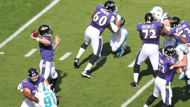 Eugene Monroe (60) blocks for Joe Flacco. Photo Credit: Brad Barr-USA TODAY Sports