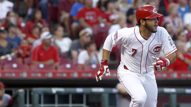 Reds shortstop Eugenio Suarez (7) drives in a run with single in the second inning against the Arizona Diamondbacks at Great American Ball Park. (David Kohl-USA TODAY Sports)