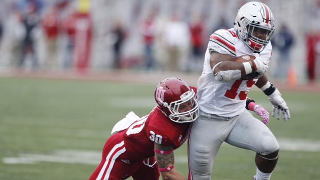Oct 3, 2015; Bloomington, IN, USA; Ohio State Buckeyes running back Ezekiel Elliott (15) is tackled by Indiana Hoosiers safety Chase Dutra (30) at Memorial Stadium. Ohio State defeats Indiana 34-27. Mandatory Credit: Brian Spurlock-USA TODAY Sports