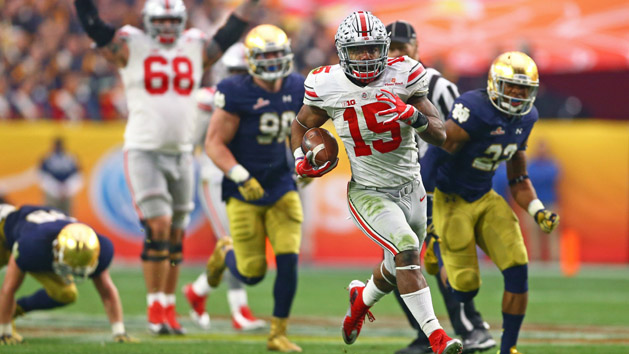 Jan 1, 2016; Glendale, AZ, USA; Ohio State Buckeyes running back Ezekiel Elliott (15) runs the ball against the Notre Dame Fighting Irish during the 2016 Fiesta Bowl at University of Phoenix Stadium. The Buckeyes defeated the Fighting Irish 44-28. Mandatory Credit: Mark J. Rebilas-USA TODAY Sports