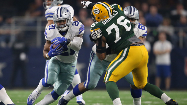 Jan 15, 2017; Arlington, TX, USA; Dallas Cowboys running back Ezekiel Elliott (21) runs with the ball behind the block of guard Ronald Leary (65) against Green Bay Packers defensive tackle Mike Daniels (76) in the NFC Divisional playoff game at AT&T Stadium. Photo Credit: Matthew Emmons-USA TODAY Sports