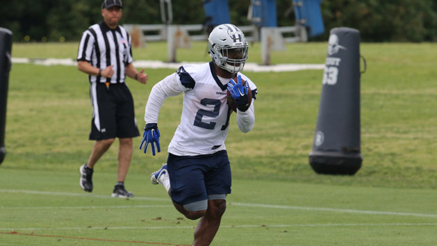 May 25, 2016; Irving, TX, USA; Dallas Cowboys running back Ezekiel Elliott (21) runs with the ball during organized team activities at Dallas Cowboys Headquarters. Mandatory Credit: Matthew Emmons-USA TODAY Sports