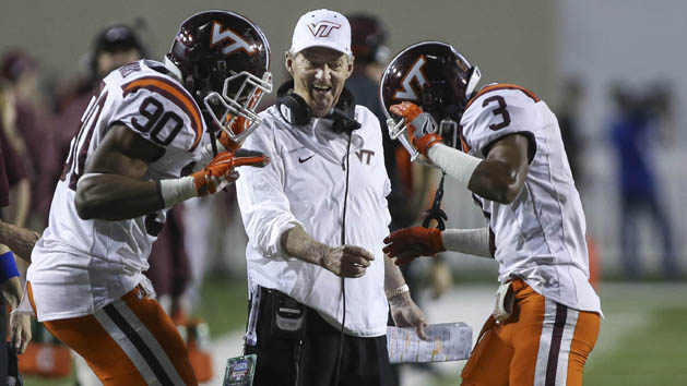 Virginia Tech Hokies head coach Frank Beamer celebrates with defensive end Dadi Lhomme Nicolas (90) and cornerback Greg Stroman (3) after Stroman returns a punt for a touchdown during the second quarter against the Tulsa Golden Hurricane at Independence Stadium. Photo Credit: Troy Taormina-USA TODAY Sports
