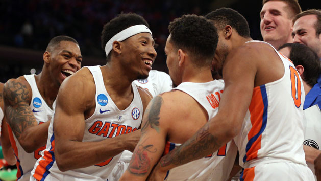 Mar 24, 2017; New York, NY, USA; The Florida Gators celebrates with guard Chris Chiozza (11) after he hit the game winning the shot to beat the Wisconsin Badgers during overtime in the semifinals of the East Regional of the 2017 NCAA Tournament at Madison Square Garden. Photo Credit: Brad Penner-USA TODAY Sports